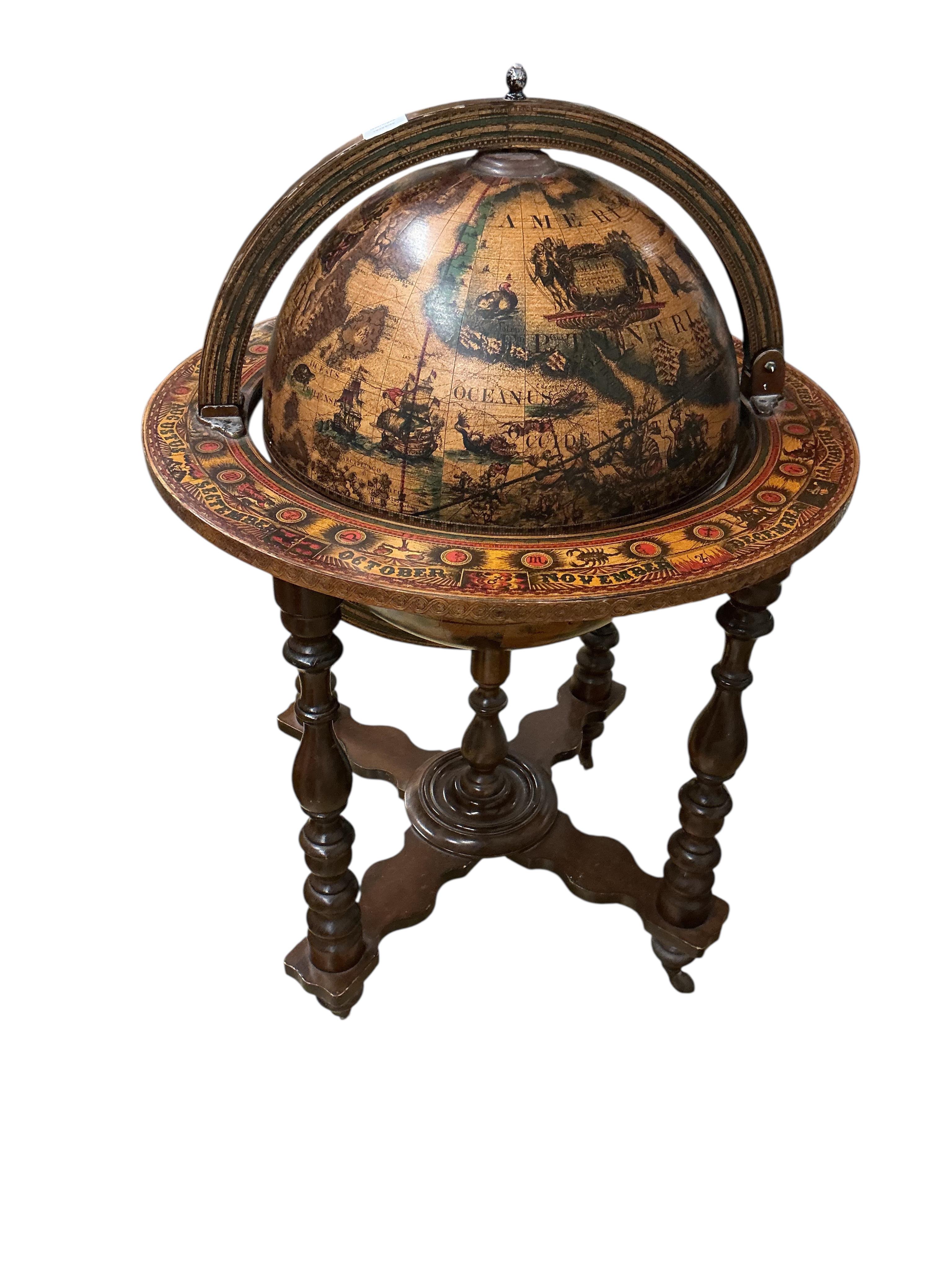 A reproduction globe drink's trolley, height 102cm